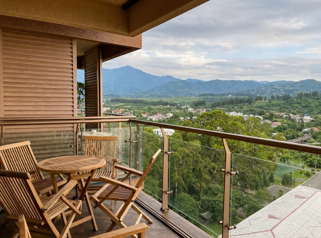Wooden terrace seating with mountain panorama at golden hour